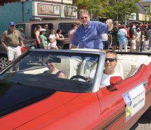 Mackinac bridge 50th anniversary parade in Mackinaw City, William H. Gnodtke in car
